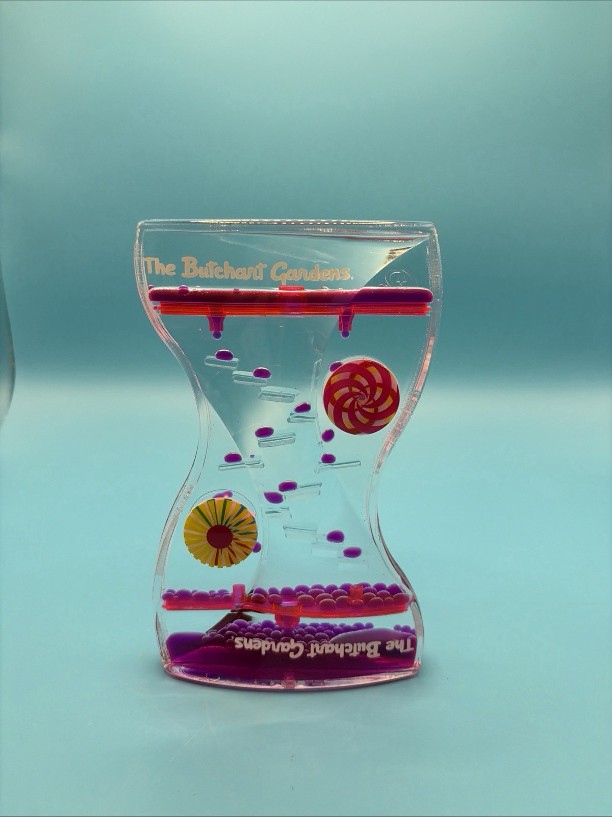 Liquid Motion Bubbler Timer The Butchart Gardens Drip Sensory Toy Pink Purple