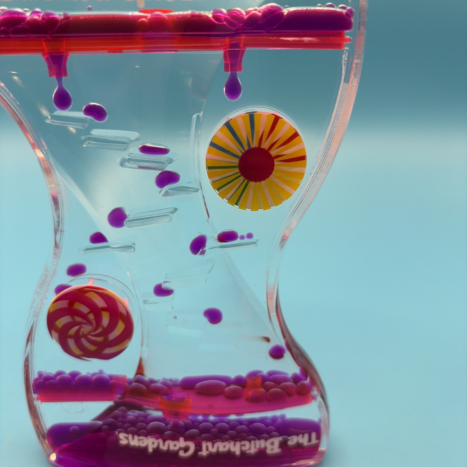 Liquid Motion Bubbler Timer The Butchart Gardens Drip Sensory Toy Pink Purple