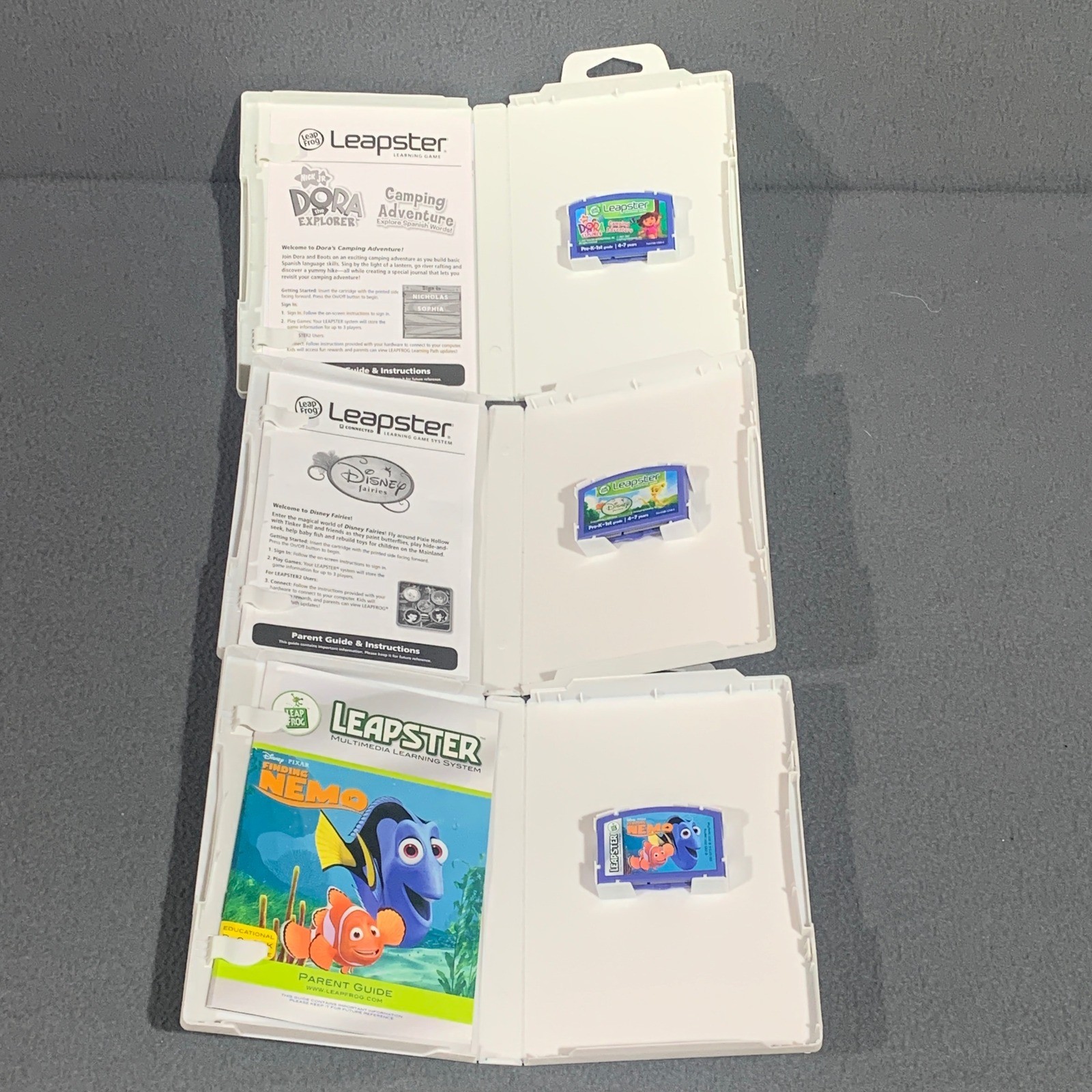 LeapFrog Leapster Games Lot of 3 Finding Nemo Disney Fairies Dora Explorer Case