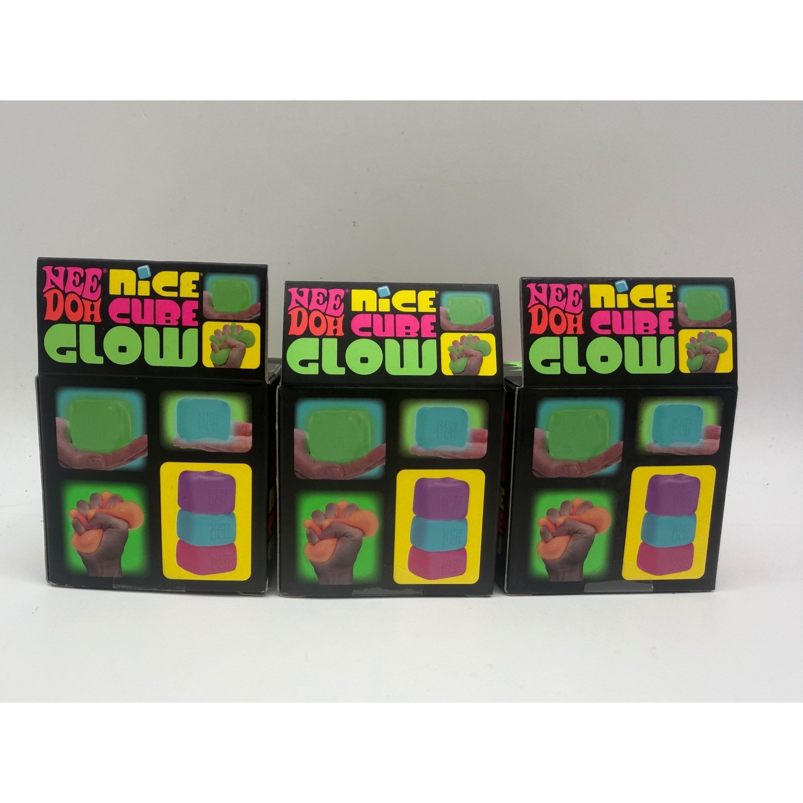 Schylling NeeDoh Nice Cube Glow Fidget Toy 3 Pack Green Orange Pink Glow In Dark