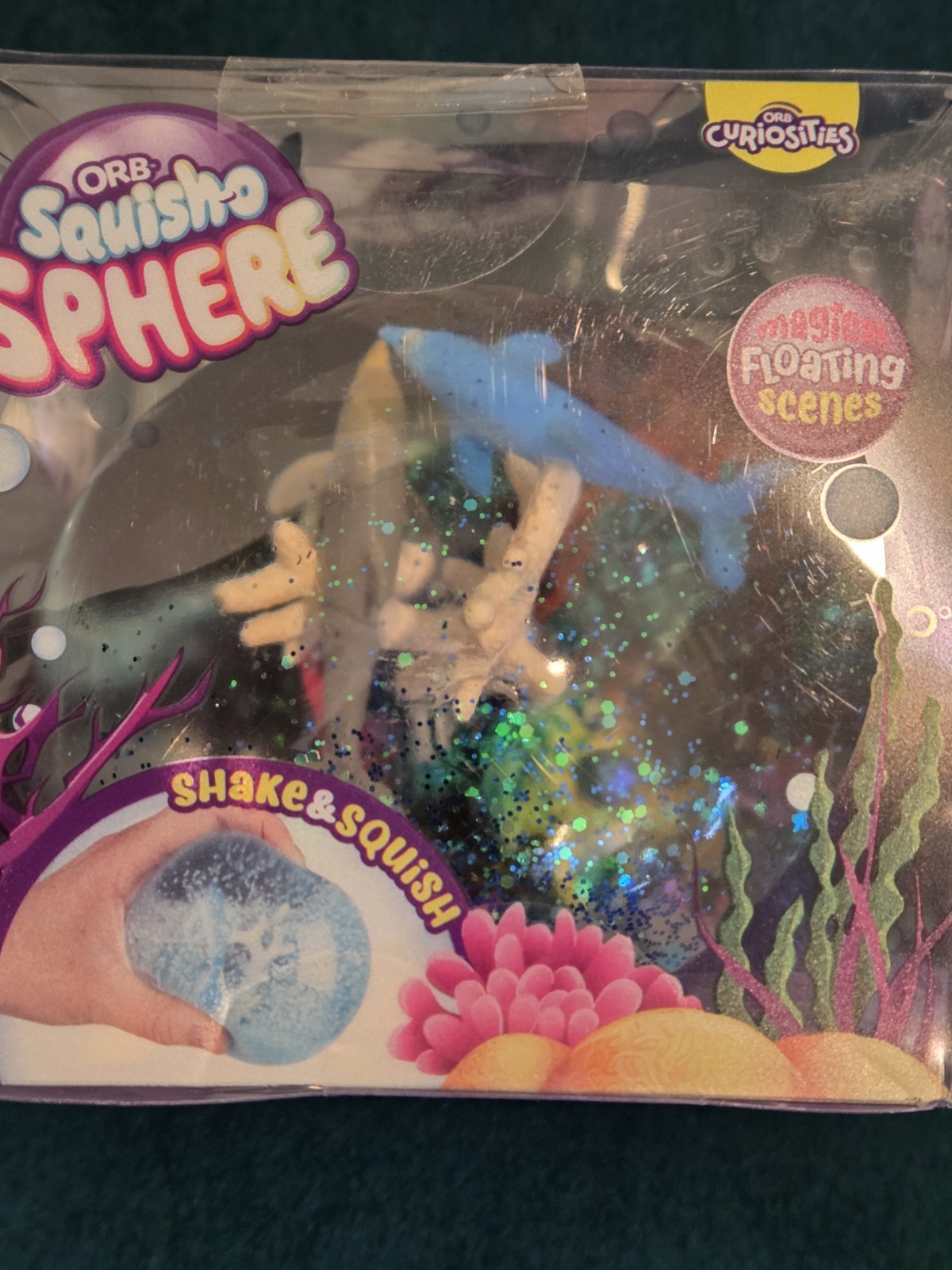 ORB™ Squish-O Sphere Squish Toy Fidget Stress Fun Dolphin Aquarium