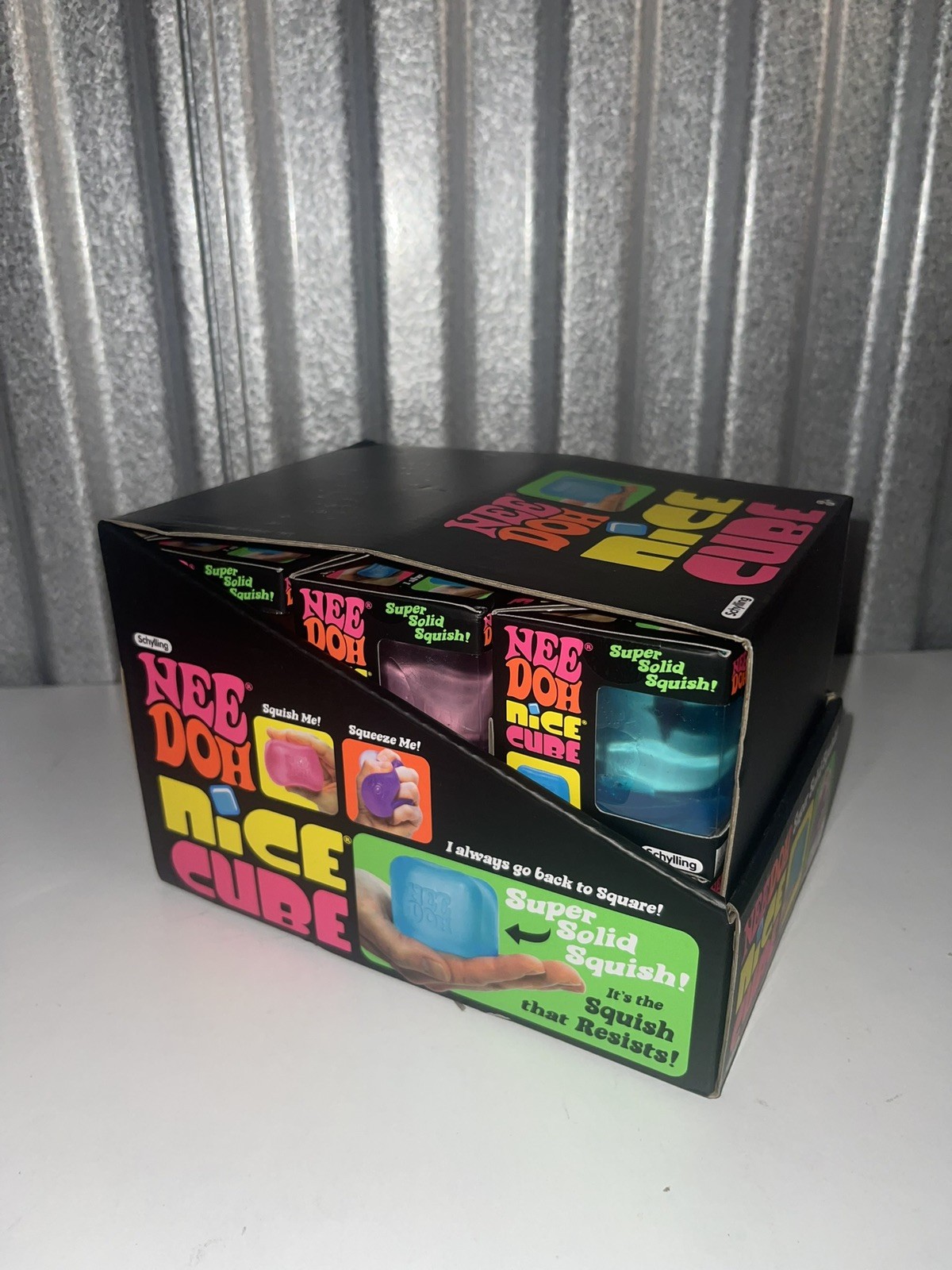 Lot Of (12) – Full Case NeeDoh Nice Cube Display – All 3 Colors