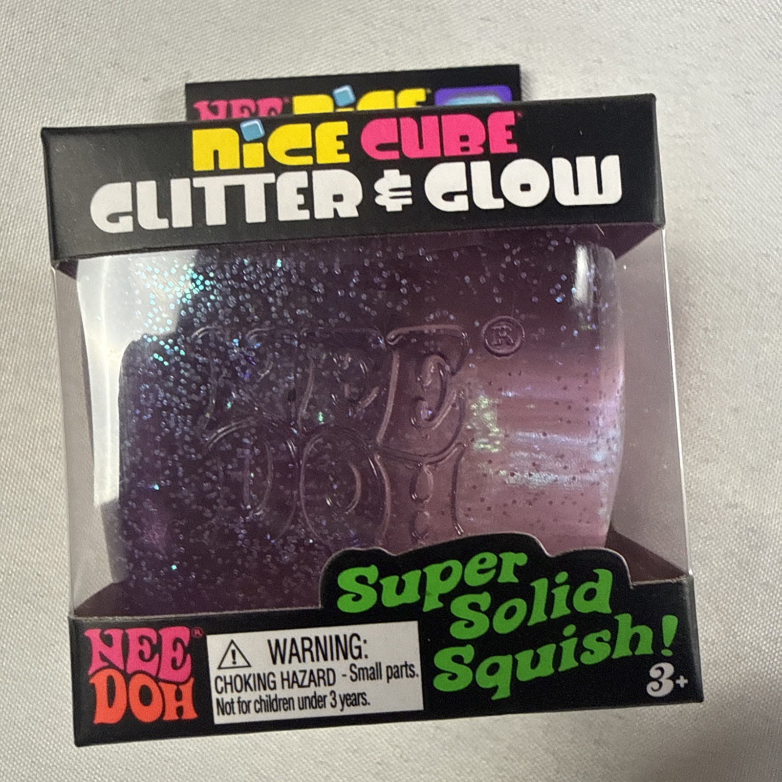 NeeDoh Nice Cube Glitter and Glow, Squishy, Glowing Ice Cube Pink And Blue