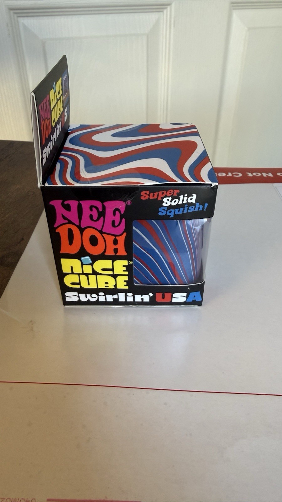 NeeDoh Nice Cube Swirlin’ USA Super Solid Squish Squeeze Toy, Red/White/Blue