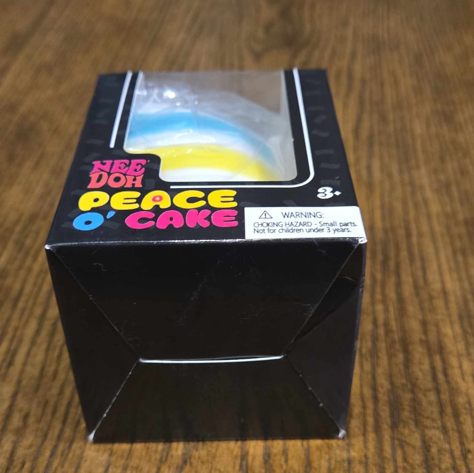 Nee Doh Peace O’ Cake Squeeze Sensory Toy White Blue Yellow Ages 3-11 3+ Years