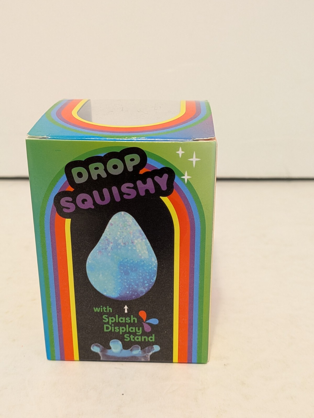 Drop Squishy Blue Glitter Tactile Squishy Squeeze Toy w/ Splash Display Stand