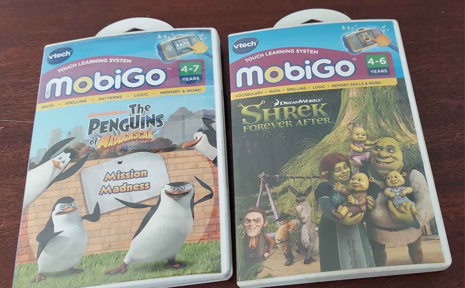 Lot of 2 VTech MobiGo Games Shrek & The Penguins.