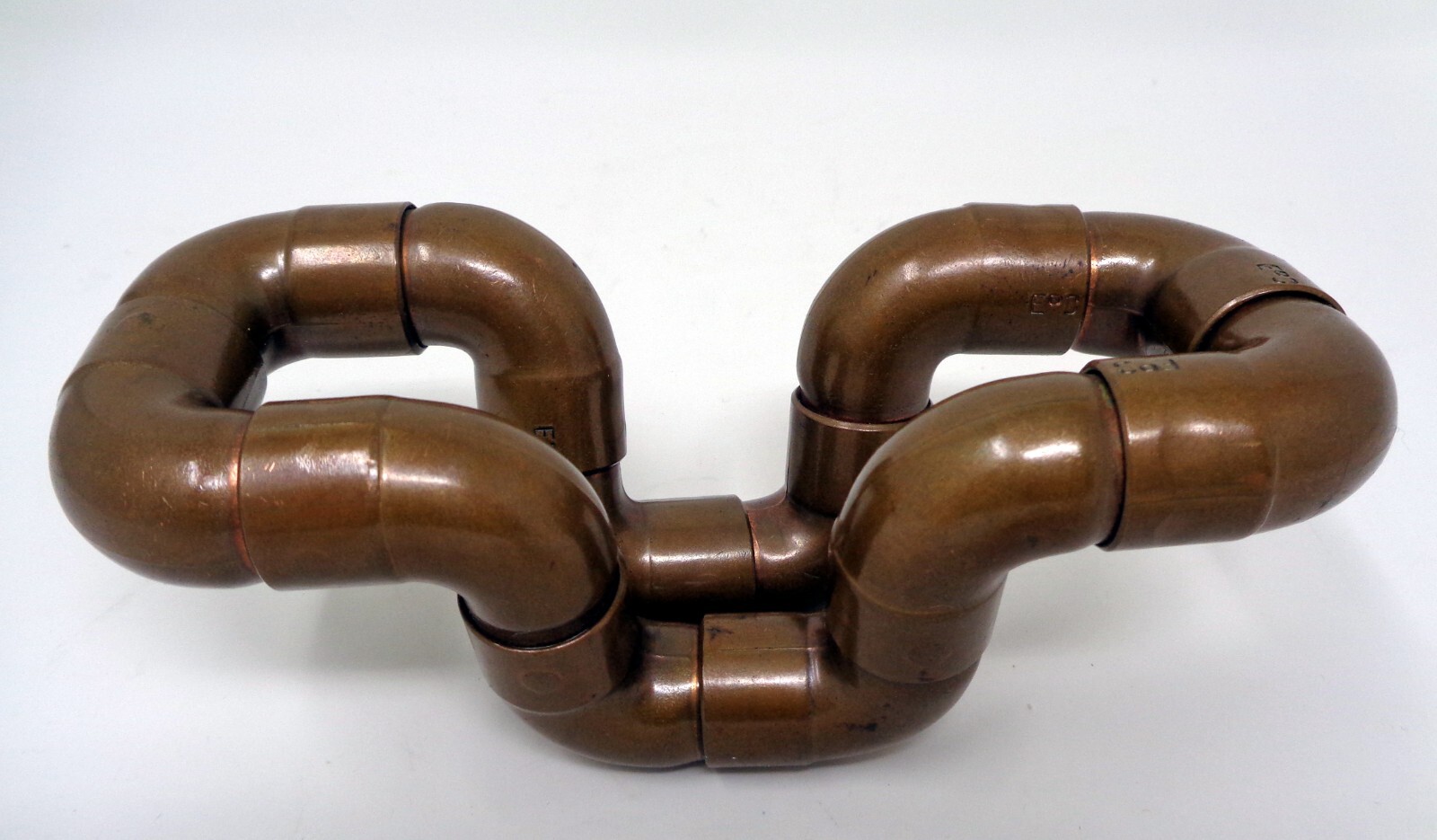 Metallic Bronze Twist In Many Shapes Toy