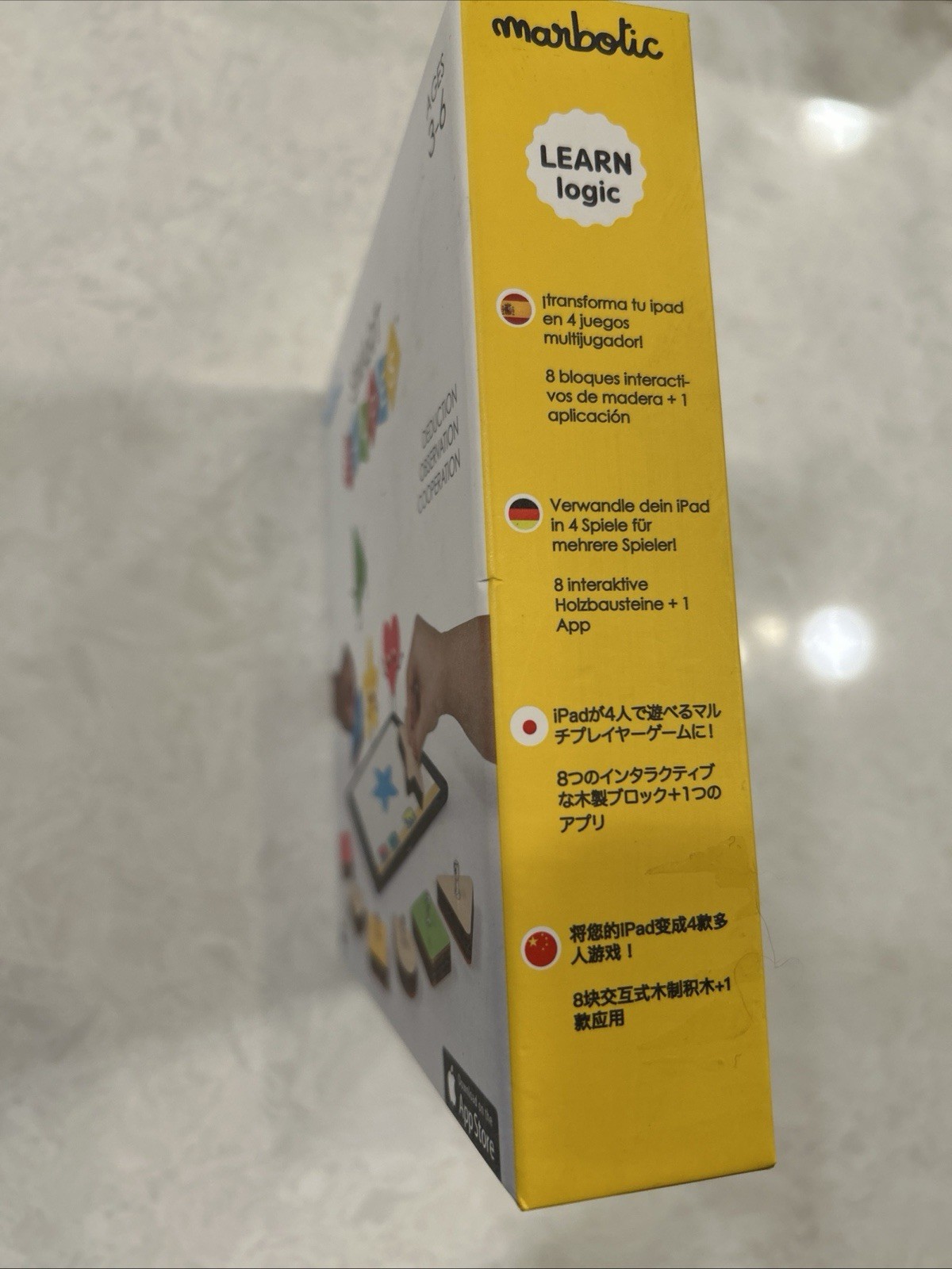 Marbotic Smart Shapes interactive learning toy with physical wooden shapes.
