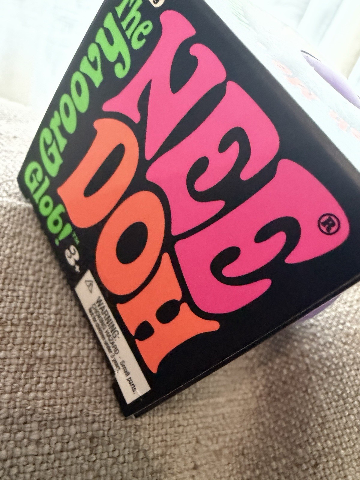 Schylling Groovy Nee Doh Glob 3″ Squeeze Toy, Black/Pink/Orange/Green/Purple 4+