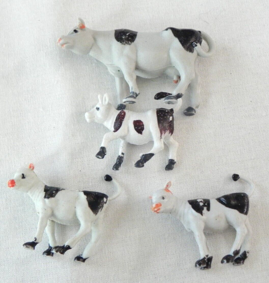 Set of 4 Holstein cows farm animals calves unknown vintage Singapore Hong