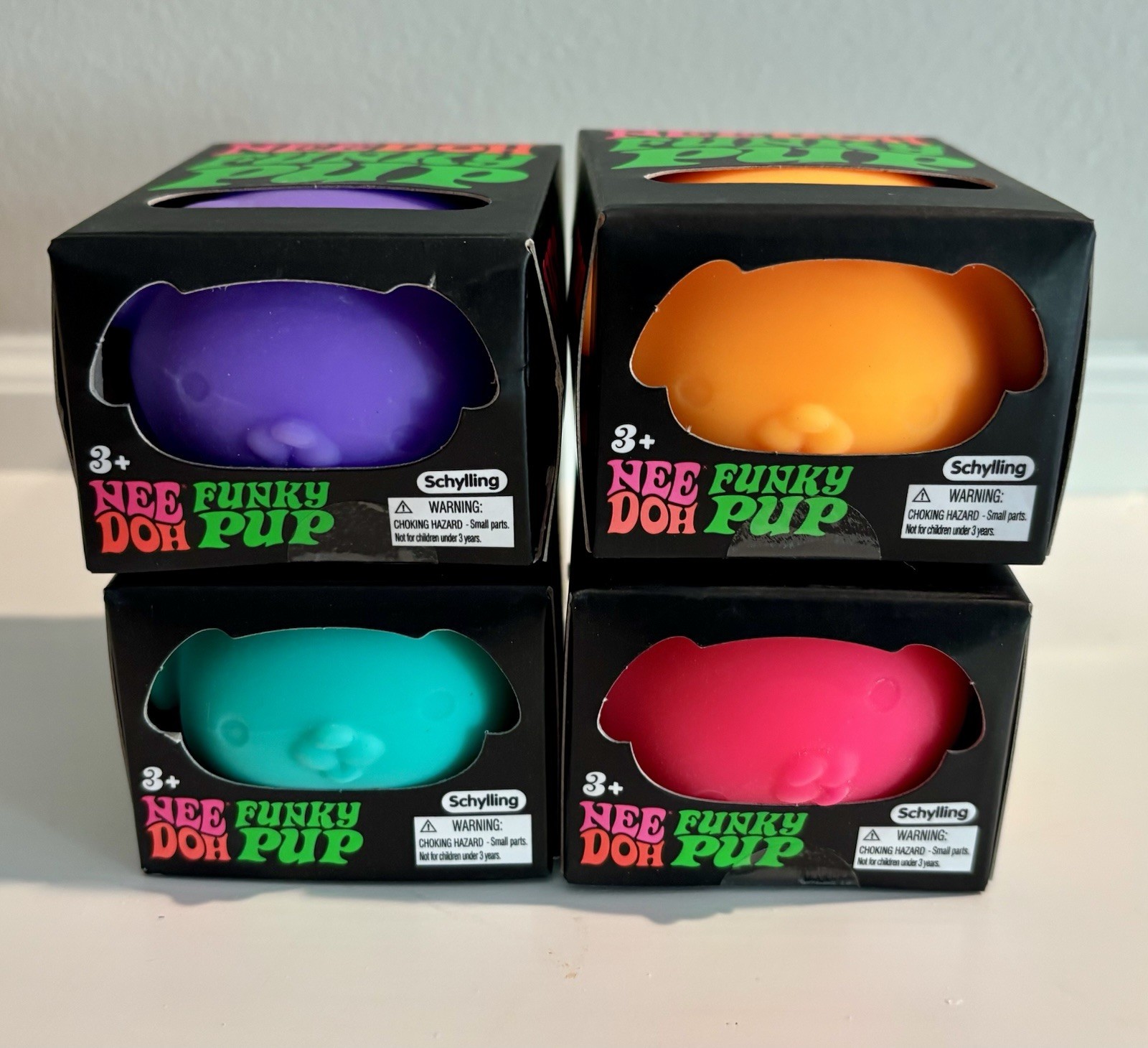 Needoh Funky Pup Toy Lot of 4 – Orange, Teal/Blue, Pink & Purple Schylling