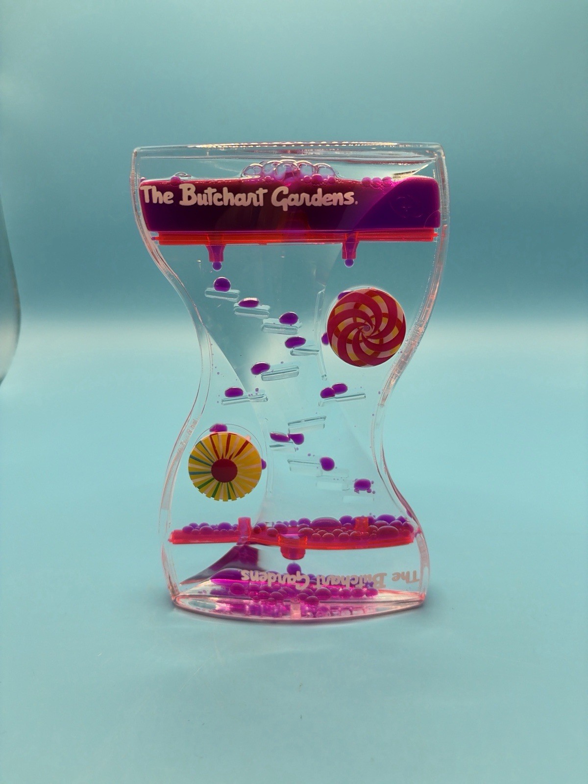 Liquid Motion Bubbler Timer The Butchart Gardens Drip Sensory Toy Pink Purple