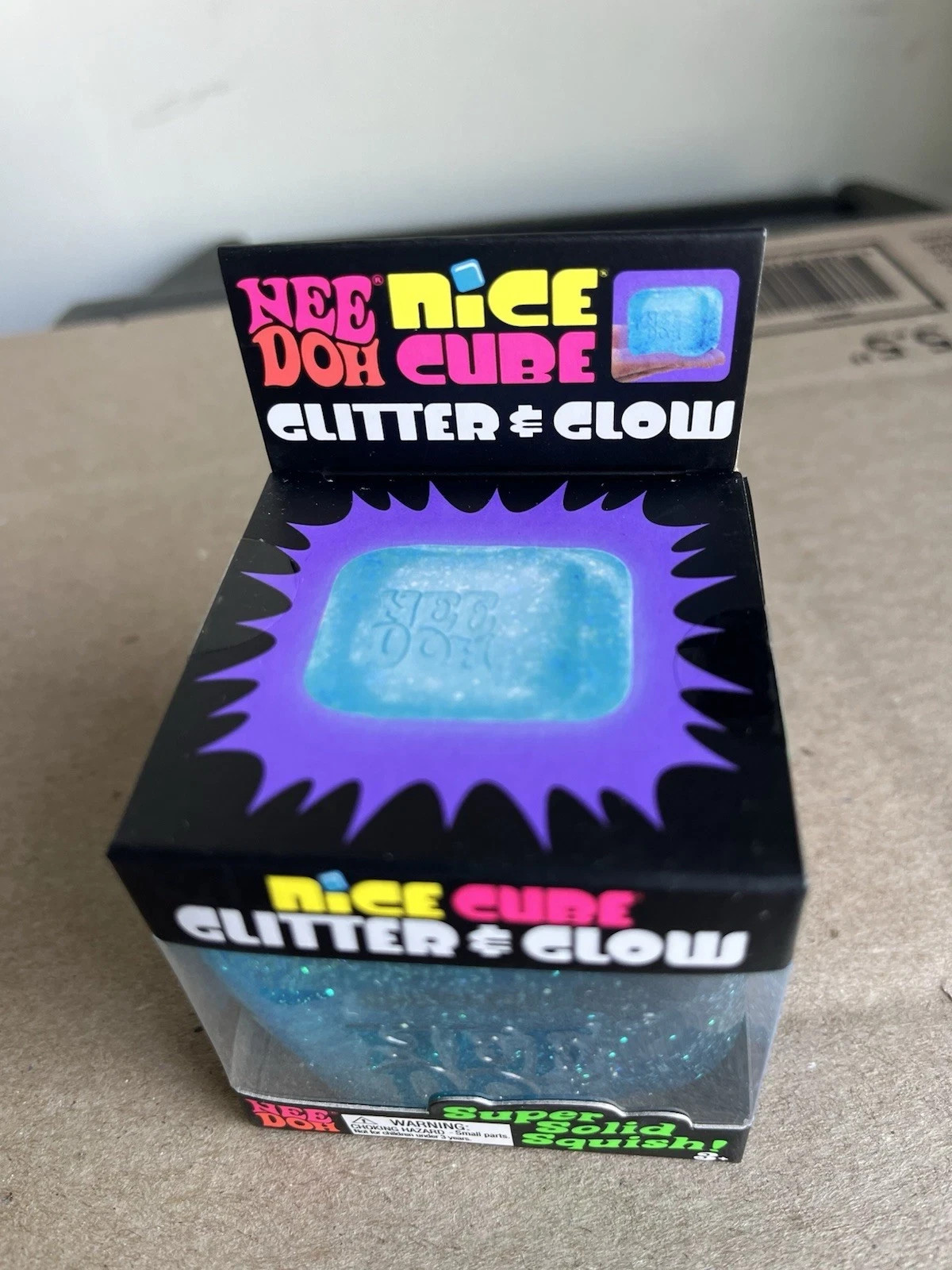 NeeDoh Nice Cube Glitter and Glow Nee Doh Squishy Glowing Ice Schilling Toy BLUE